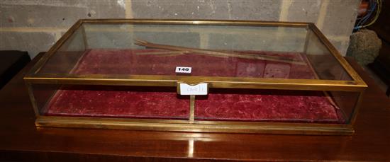 A Victorian brass framed table top display case, a.f., width 68cm, depth 34.5cm, height 12cm
